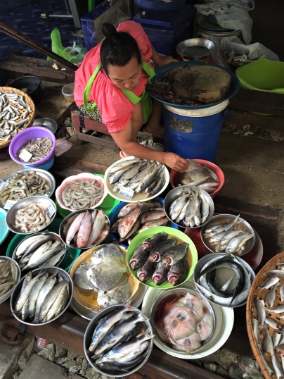 Fish vendor at the Maeklong Railway Market